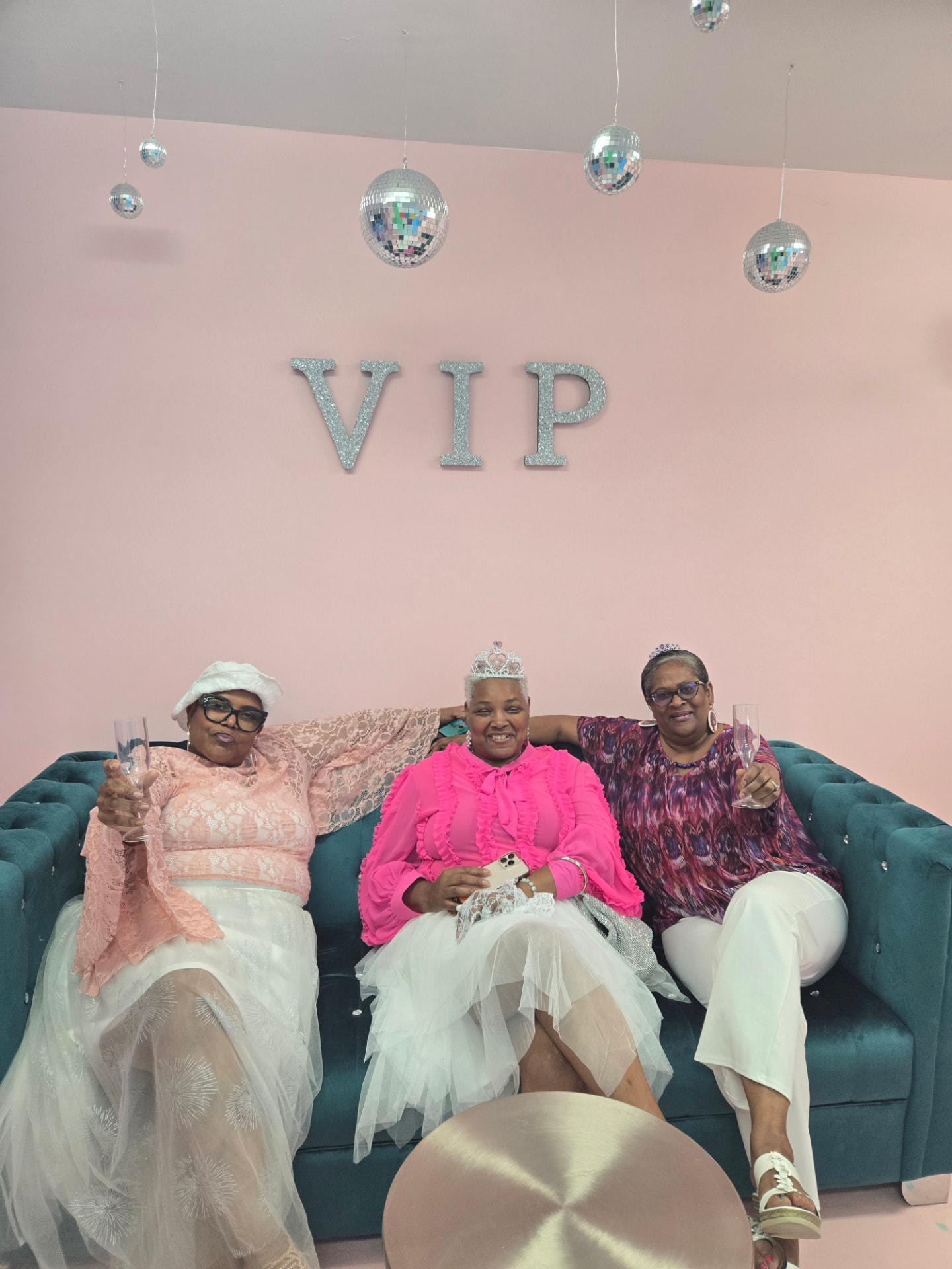 Guests toasting with champagne in the VIP lounge at The Williamsburg Selfie Museum