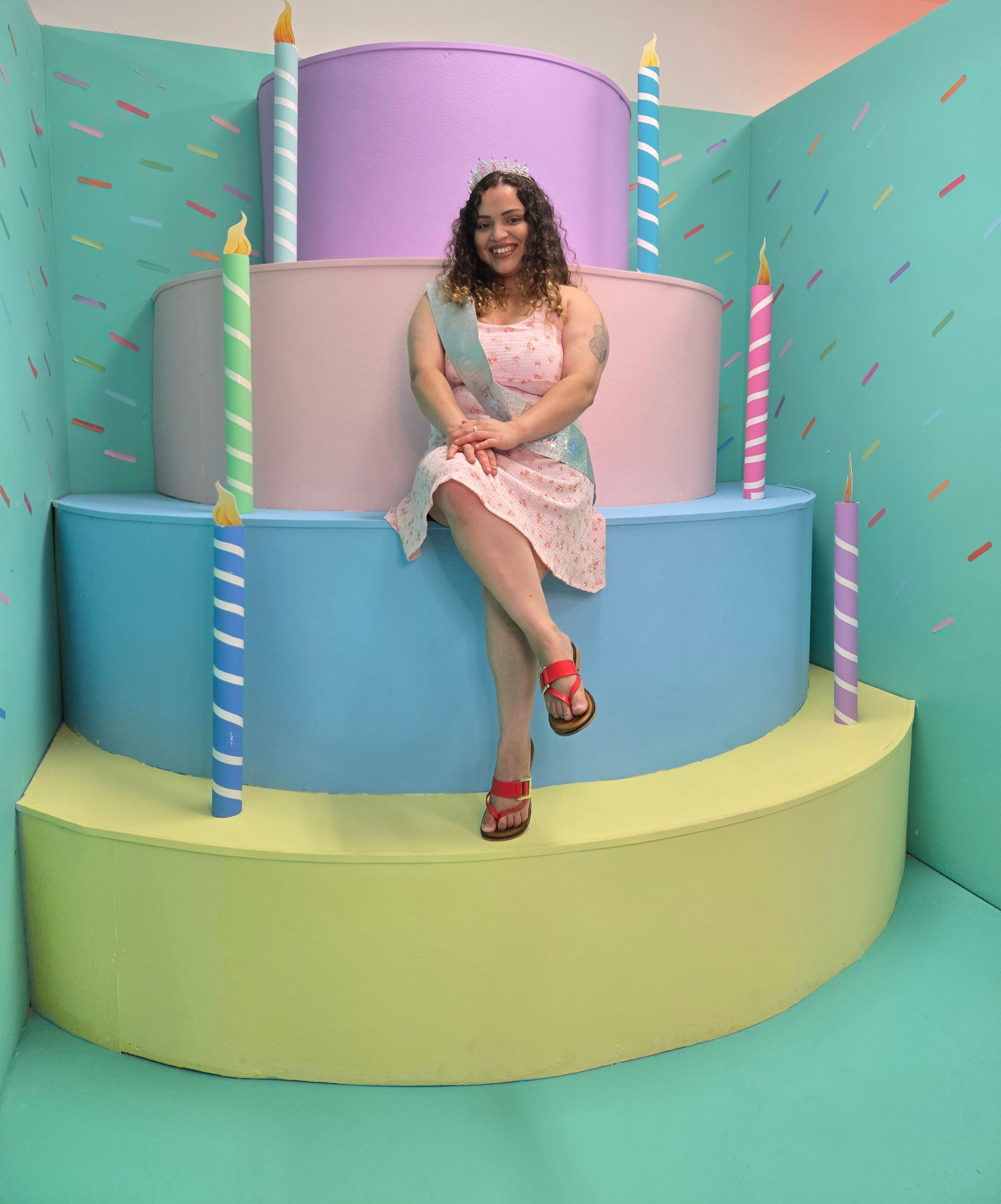 Giant tiered birthday cake photo prop at the selfie museum